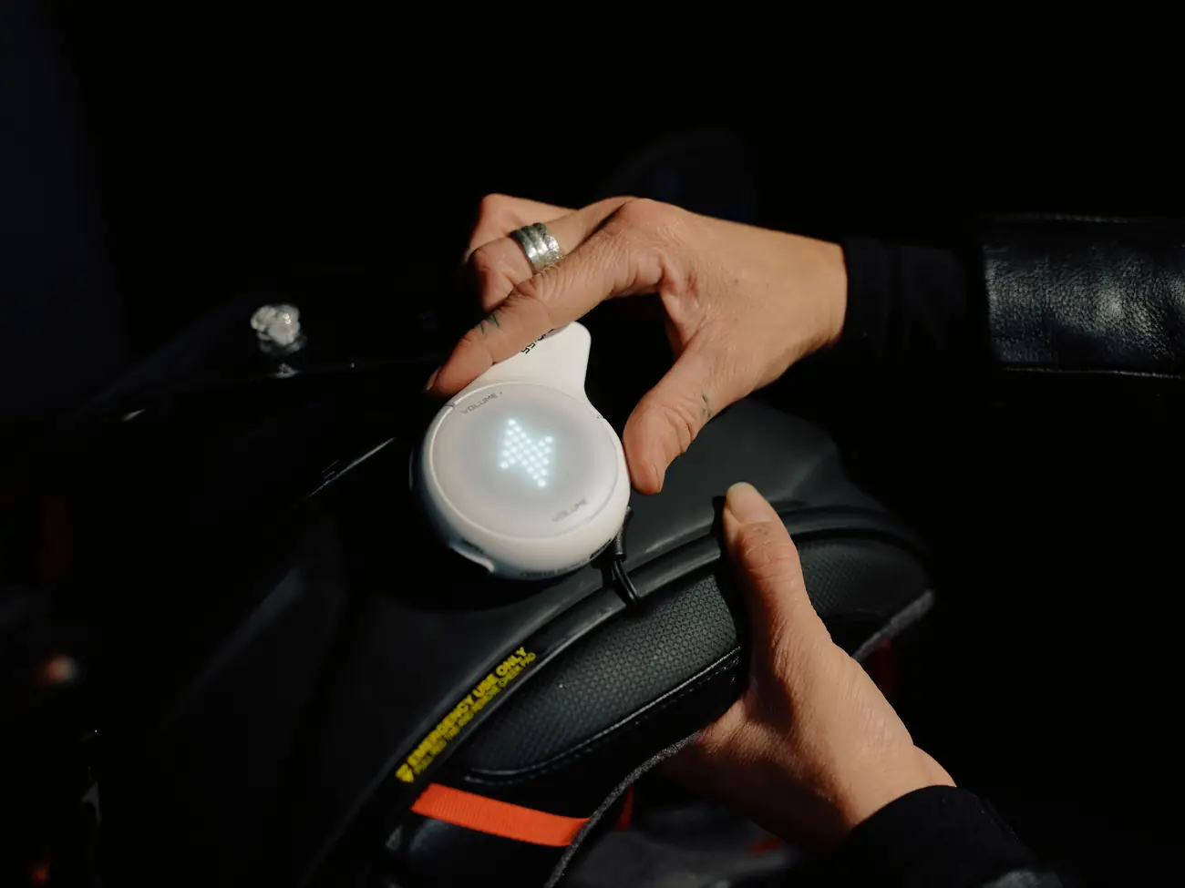Hands clipping the Jet White Rogue onto a helmet base